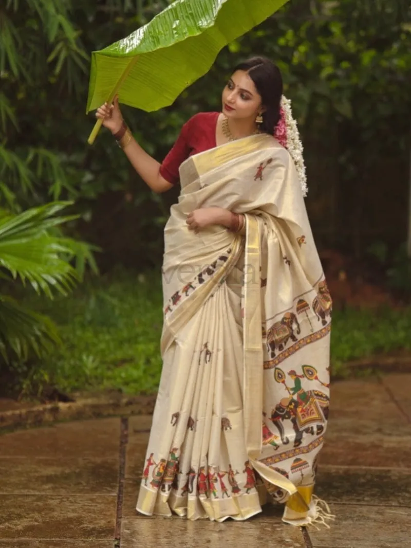 Onam Special Mural Print Kurti in premium quality golden tissue fabric.